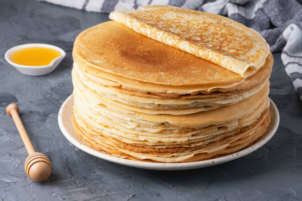 istock Stack of traditional russian pancakes blini on gray background with copy space. Homemade russian thin pancakes blini. Russian food, russian kitchen 2185789018