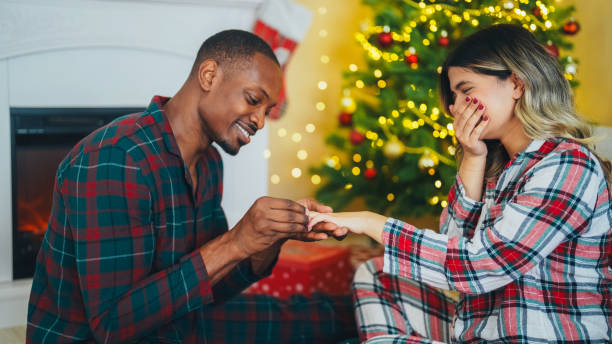 istock Young man proposing to his girlfriend on Christmas Eve 2185789250
