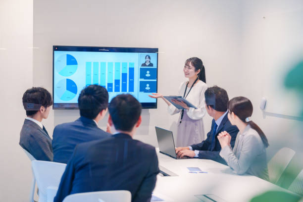 istock Young woman giving a presentation in a conference room 2185790205