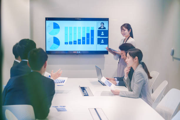 istock Young woman giving a presentation in a conference room 2185790216