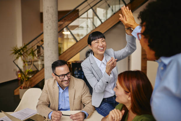 istock High-Energy Team Collaboration with Excited Professionals in Modern Office 2185790838