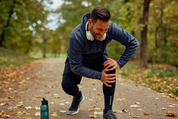 istock Man Experiencing Knee Pain During Outdoor Jogging Session 2185791103