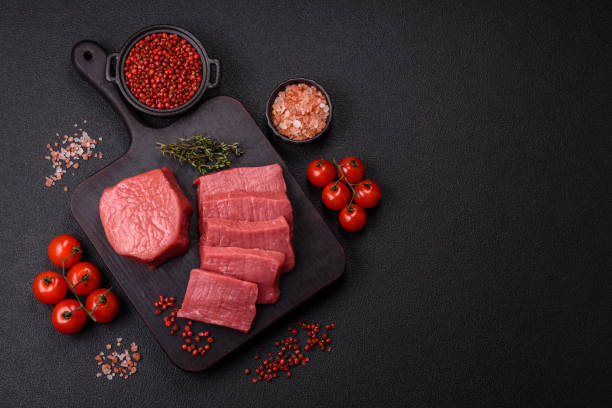 istock Juicy raw beef cut into slices with salt and spices 2185791760