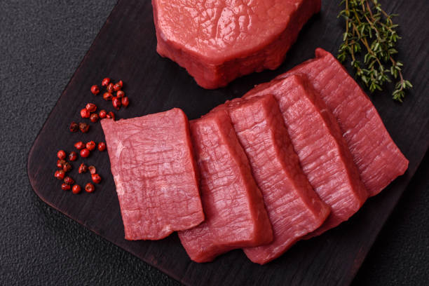 istock Juicy raw beef cut into slices with salt and spices 2185791771