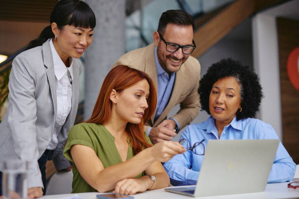 istock Diverse Business Team Collaborating on a Project in Modern Office 2185791812