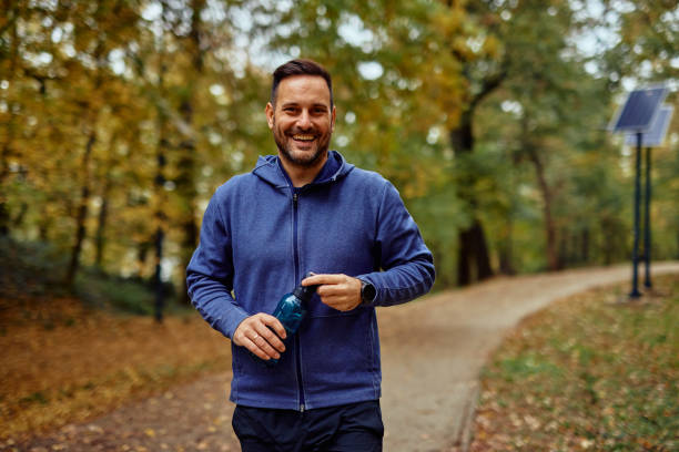 istock An athlete Outdoors Holding Water Bottle in Park 2185791852