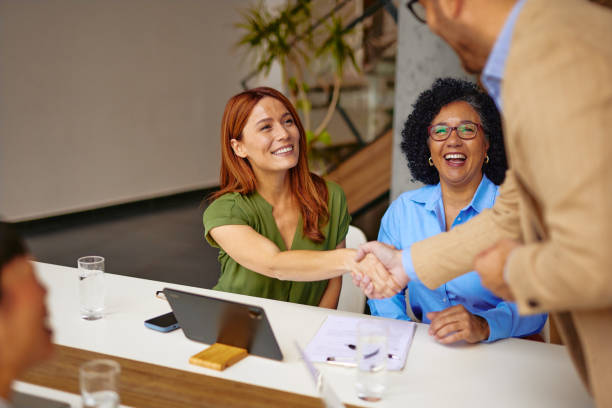 istock Diverse Business Team in a Meeting with Handshake Moment 2185792021