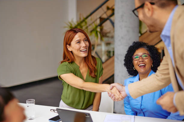 istock Diverse Business Team in a Meeting with Handshake Moment 2185792025