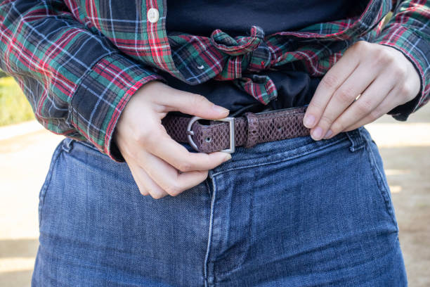 istock young girl fastens her pants belt 2185796448