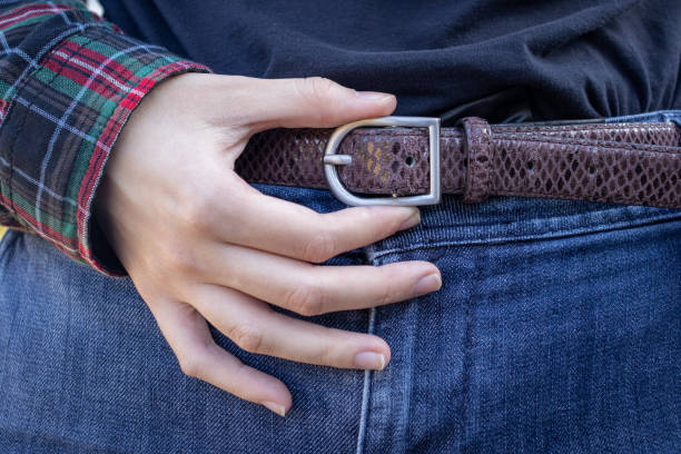 istock young girl fastens her pants belt 2185796482