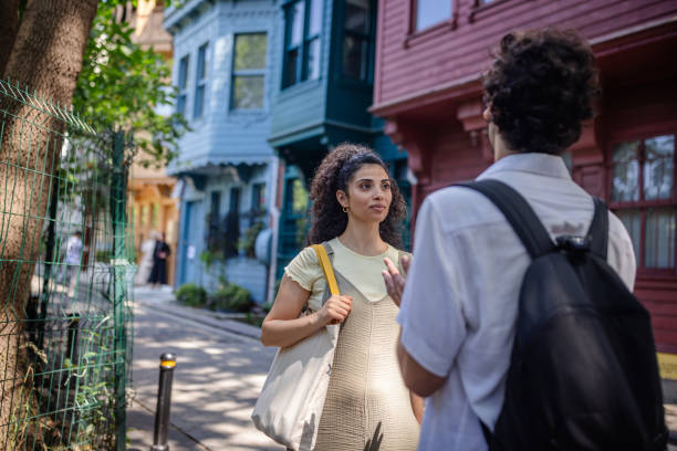 istock Conversation in colorful street with historic charm 2185798677