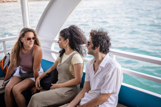 istock Relaxed conversation among friends on a sunny boat 2185802000