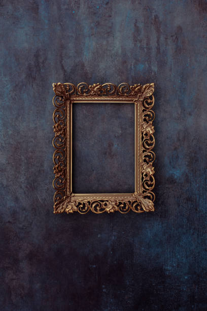 istock Golden metal frame mockup on a wall 2185803470