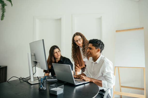 istock Employees in a project meeting in a modern office 2185803638