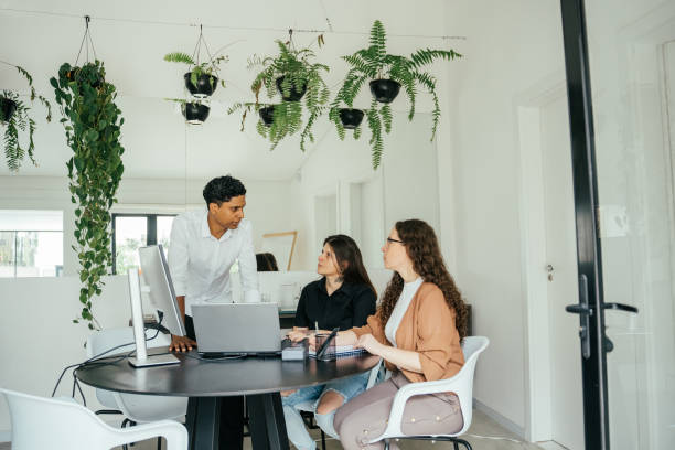 istock Employees in a project meeting in a modern office 2185803646