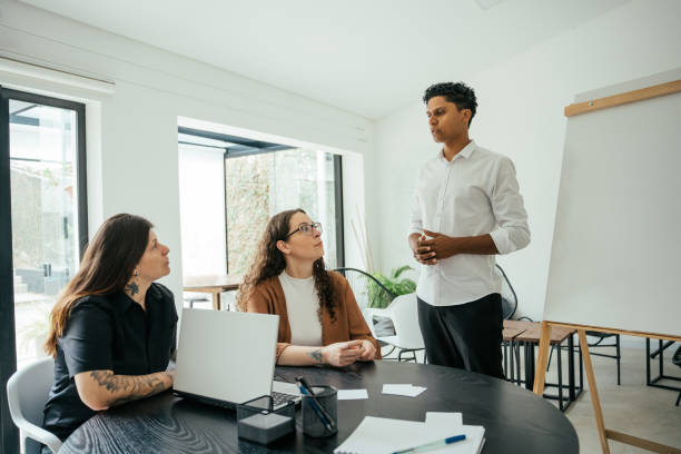 istock Employees in a project meeting in a modern office 2185803663