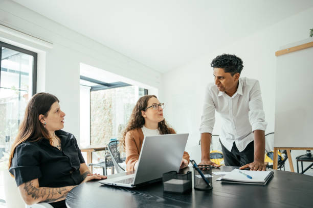 istock Employees in a project meeting in a modern office 2185803777