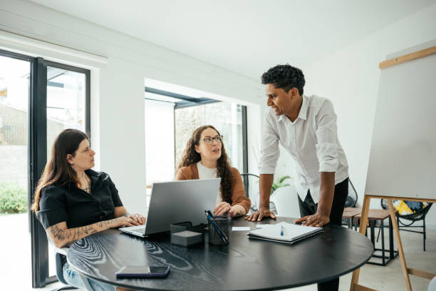 istock Employees in a project meeting in a modern office 2185804343