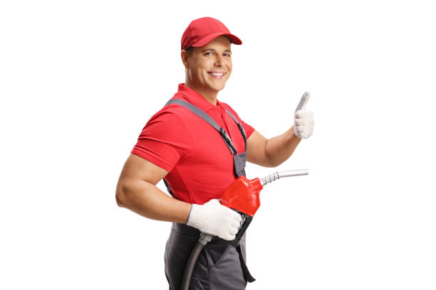 istock Gas station worker with a fuel gun gesturing thumbs up 2185806545