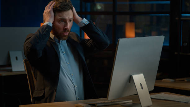 istock Frustrated stressed businessman work in evening office Caucasian middle-aged man fail lose online project on computer lost business bankruptcy failure lost job desperate anxious male losing problem 2185806697