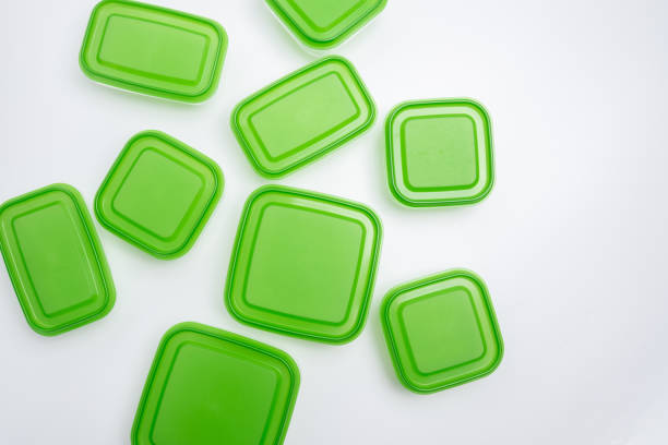 Empty plastic food containers on a light background. Organization of space. Sorting products