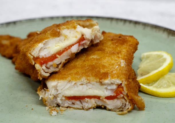 istock Closeup view of battered hake filets 2185807977