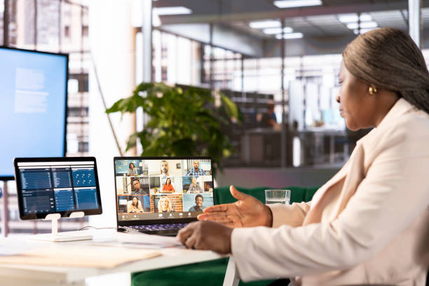 istock Manager in office talking in videocall with business partners 2185810925