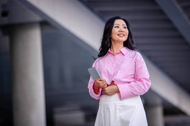 istock Woman stands confidently under contemporary structure 2185813802