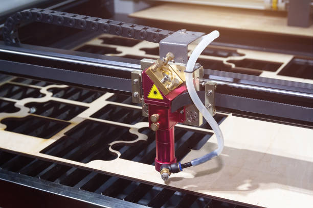 istock Laser CNC cutting wood. Modern machine industrial technology 2185817550