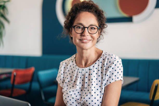 istock Smiling businesswoman at restaurant 2185819298