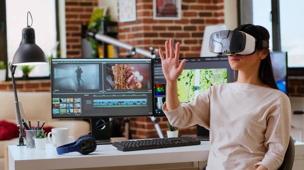 Asian modern editor using virtual reality glasses and mixing video clips Asian modern editor using virtual reality glasses and mixing video clips, using interactive gadget vr headset to edit and do color grading for a montage. Video editing software. Camera B. female film editor stock pictures, royalty-free photos & images