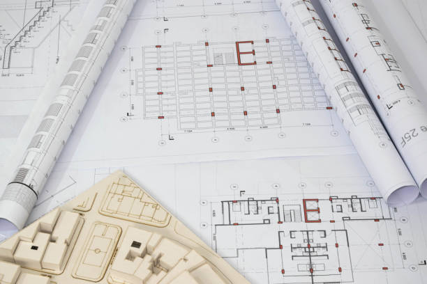Collection of architectural and construction plans. Rolled structural plans with scale architectural model.