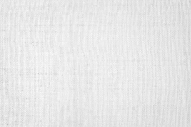 istock White color fabric canvas woven texture background in pattern light blank. Natural gauze linen, carpet wool and cotton cloth textile textured as clean empty for decoration text. Grey sack material. 2185825236