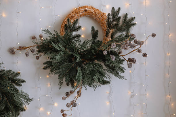 Holiday wreath decorated with pine branches and lights for festive cheer