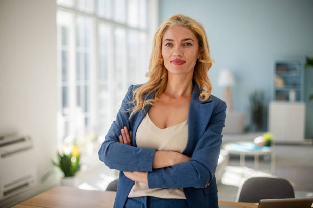 istock Confident female executive poised in modern office. 2185826688