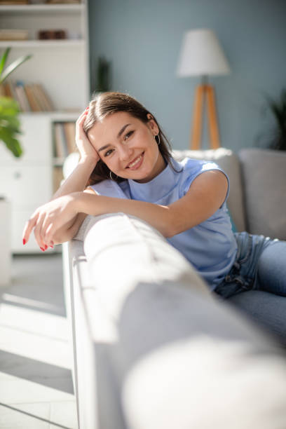 istock Contented woman brightens up a calm living space 2185827042