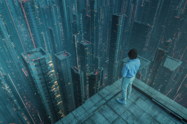istock Young man standing on skyscraper's rooftop at night 2185829681