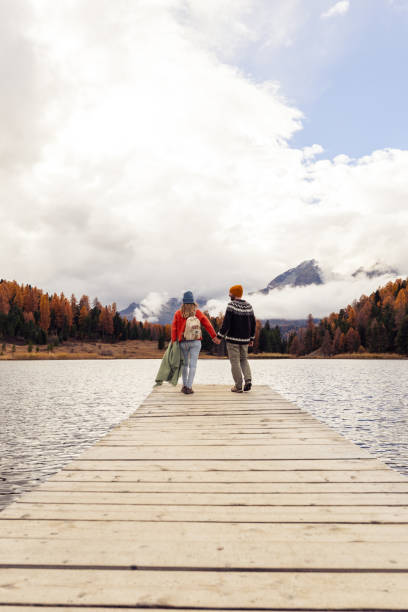 istock Couple Walking on Pier by Scenic Lake 2185844900