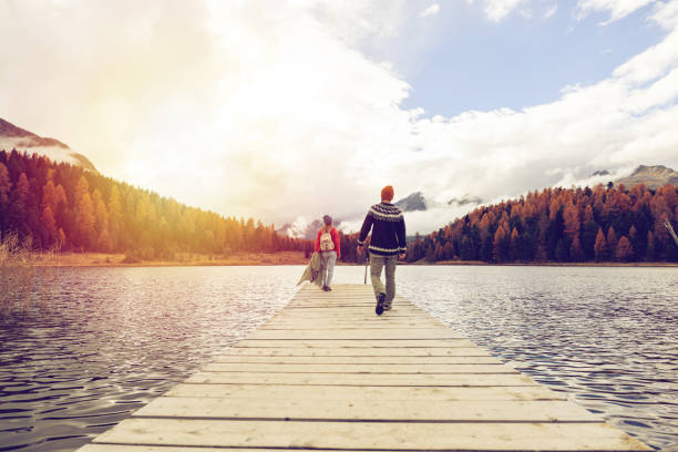 istock Couple Walking on Pier by Scenic Lake 2185844910