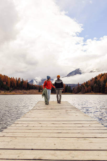 istock Couple Walking on Pier by Scenic Lake 2185844951