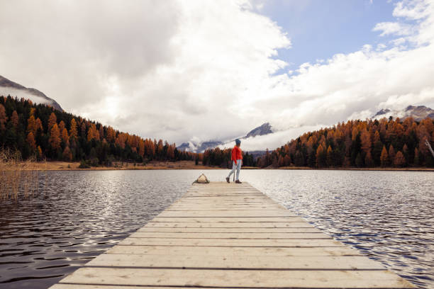 istock Strolling Along a Wooden Pier in Autumn 2185845077