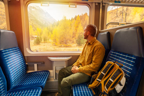 istock Passenger Enjoying Scenic Autumn Train Ride 2185848861