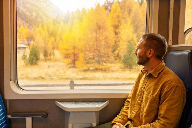istock Passenger Enjoying Scenic Autumn Train Ride 2185848871