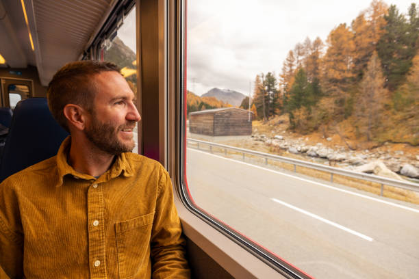 istock Passenger Enjoying Scenic Autumn Train Ride 2185848895