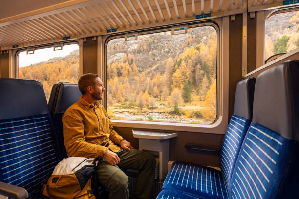 istock Passenger Enjoying Scenic Autumn Train Ride 2185848898