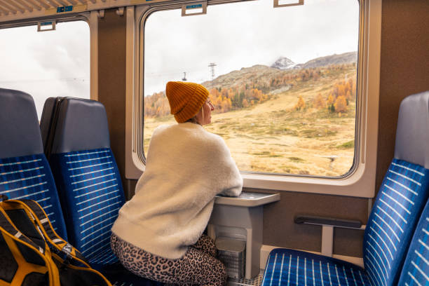 istock Woman Relaxing on Scenic Train Journey 2185848922
