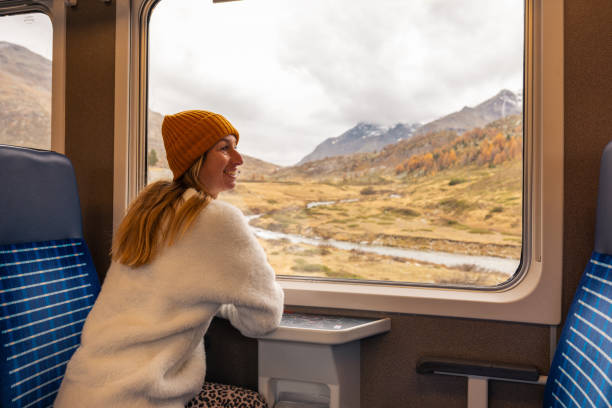 istock Woman Enjoying Scenic Mountain Train Ride 2185848925