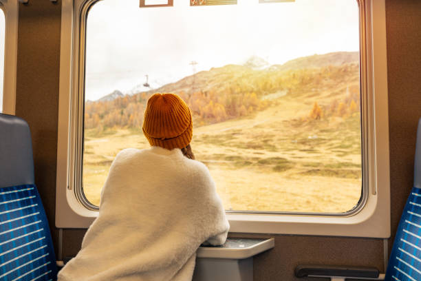istock Woman Enjoying Scenic Mountain Train Ride 2185848940