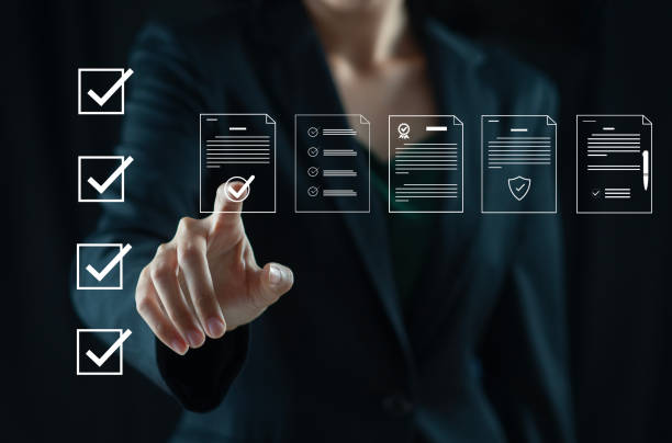 istock Businessman marking items in digital checklist. Quality assurance and document control with icons, representing quality assurance and document control processes, auditing and compliance. 2185857500