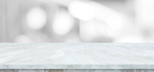 istock Empty white table top, counter, desk background over blur abstract bokeh light background, White marble stone table, shelf and blurred white backgroundt for food, product display mockup, template 2185860170